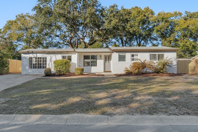 ranch-style house featuring a front lawn