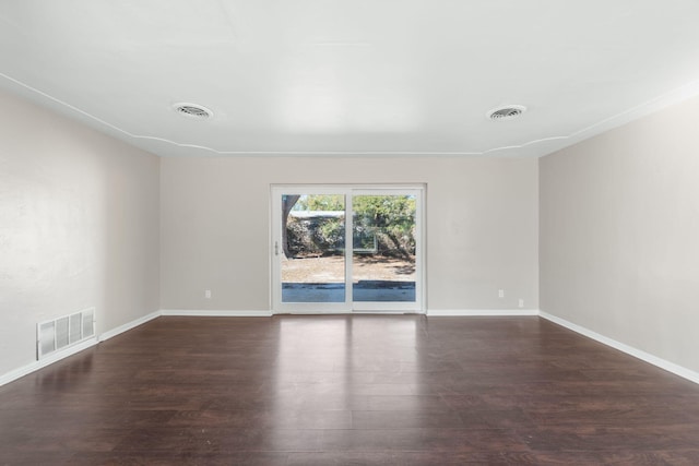 empty room featuring dark hardwood / wood-style floors