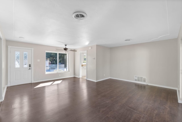 interior space featuring dark wood-type flooring and ceiling fan