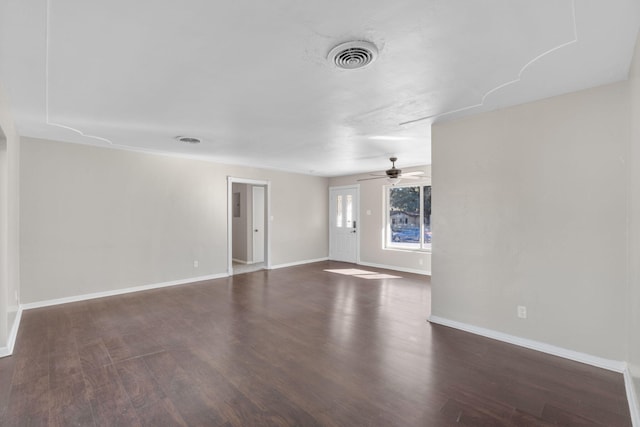 unfurnished living room with dark wood-type flooring and ceiling fan