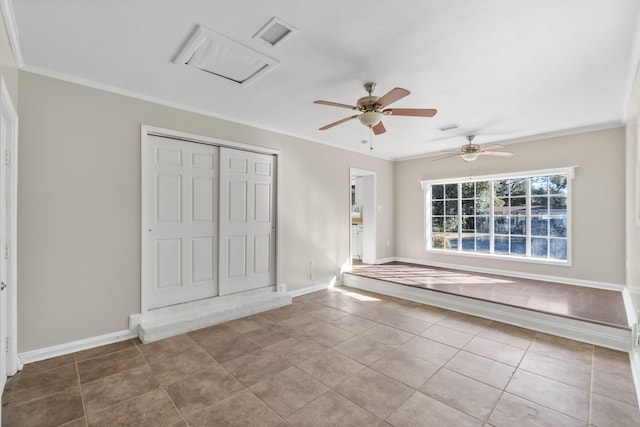 interior space featuring crown molding and tile patterned floors