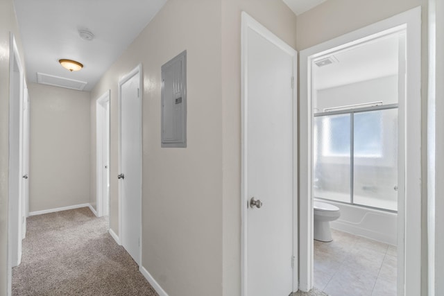 corridor with light carpet and electric panel