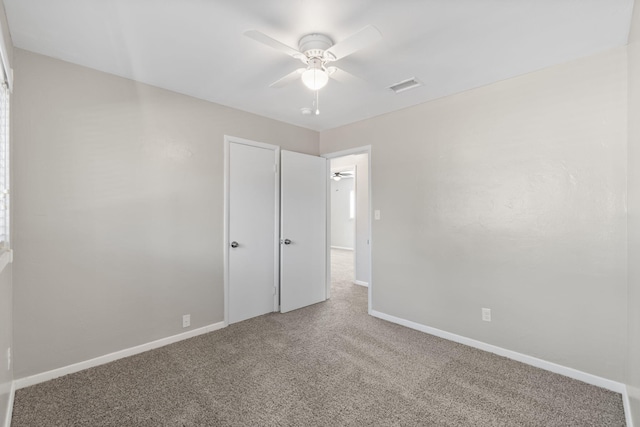 unfurnished bedroom with carpet flooring and ceiling fan