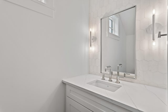 bathroom with backsplash and vanity