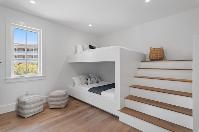 bedroom featuring recessed lighting, baseboards, and wood finished floors