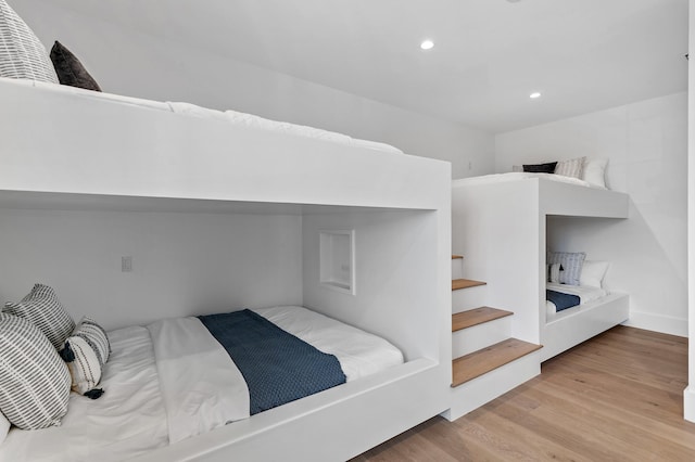 bedroom with light wood-type flooring and recessed lighting