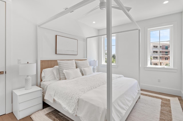 bedroom featuring ceiling fan and light hardwood / wood-style flooring