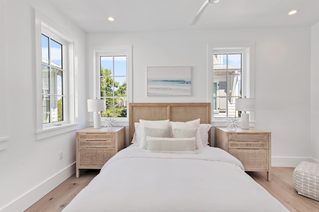 bedroom with wood-type flooring and ceiling fan