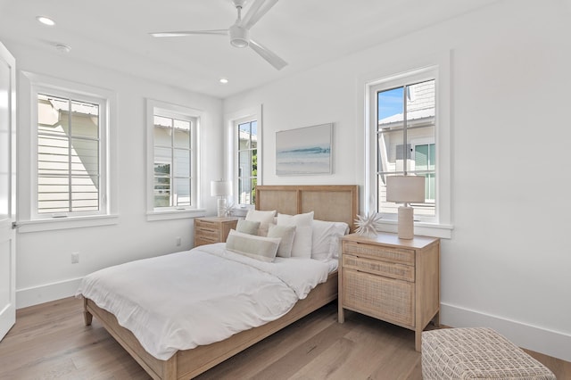 bedroom featuring light wood-style floors, baseboards, a ceiling fan, and recessed lighting