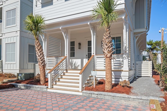 property entrance featuring board and batten siding