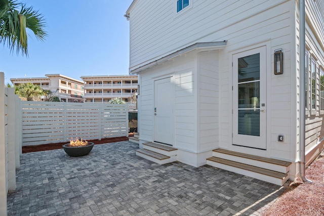 view of patio / terrace with entry steps and fence