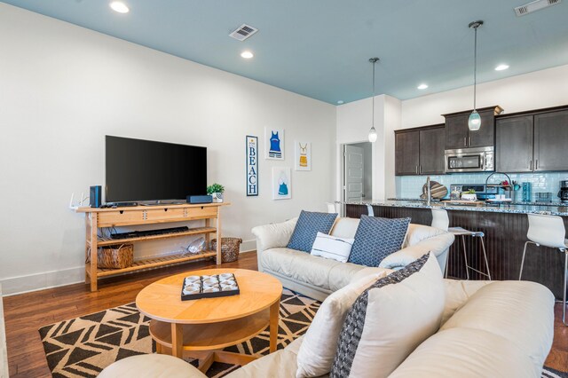 living room with dark wood-type flooring