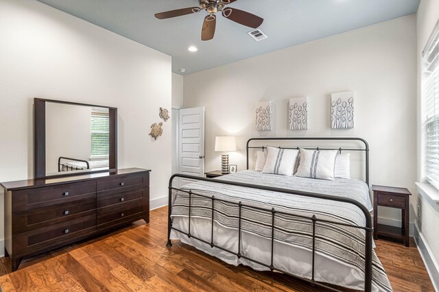 bedroom featuring dark wood-type flooring and ceiling fan