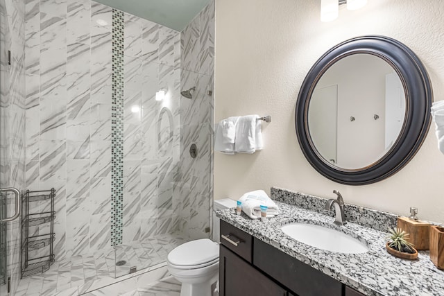 bathroom featuring vanity, toilet, and walk in shower