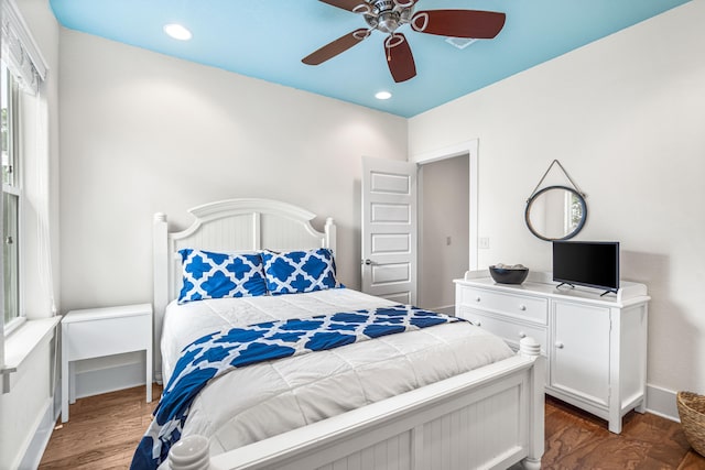 bedroom with dark wood-type flooring and ceiling fan