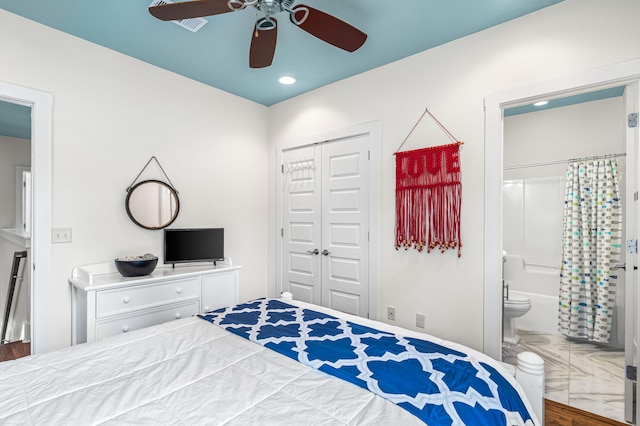 bedroom featuring a closet, ceiling fan, and connected bathroom