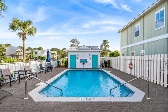 view of swimming pool featuring a patio