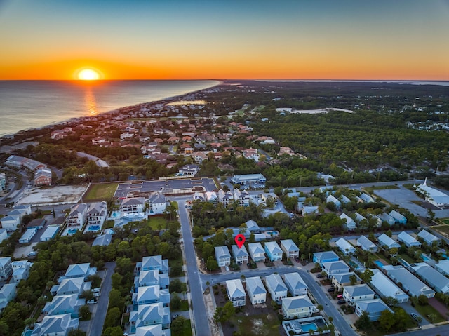 aerial view at dusk with a water view