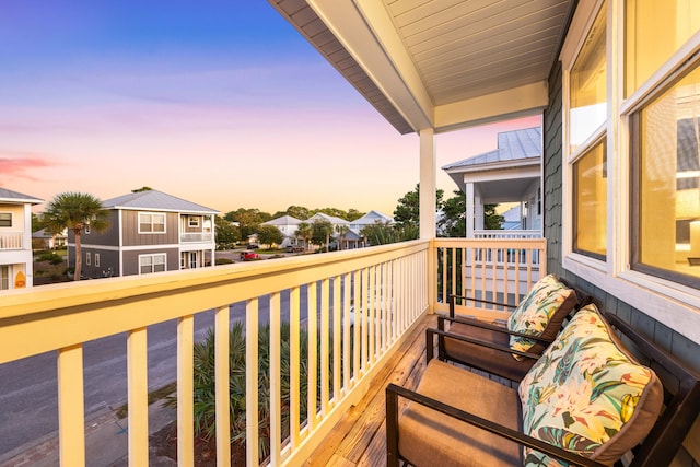 view of balcony at dusk