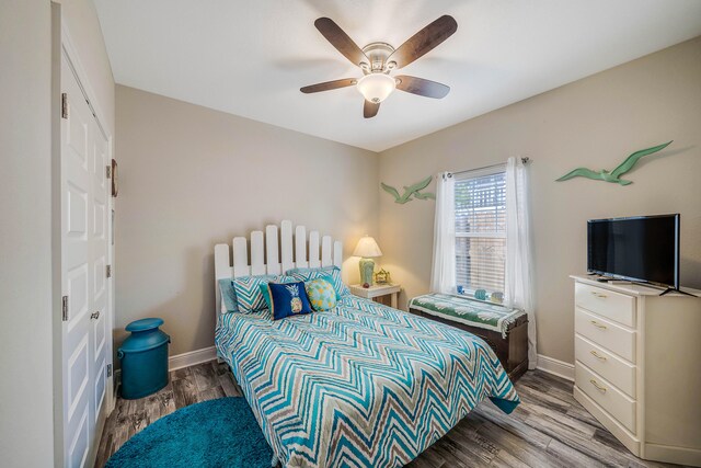 bedroom with hardwood / wood-style floors and ceiling fan