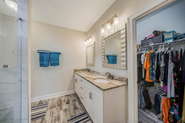 bathroom featuring hardwood / wood-style floors and vanity