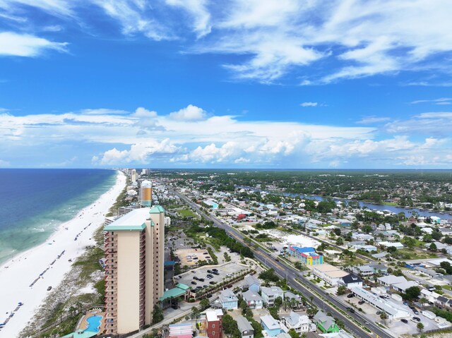 bird's eye view featuring a view of the beach and a water view