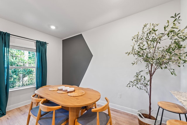 dining room with light wood-type flooring