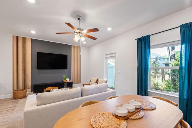 dining room featuring light wood-type flooring and ceiling fan