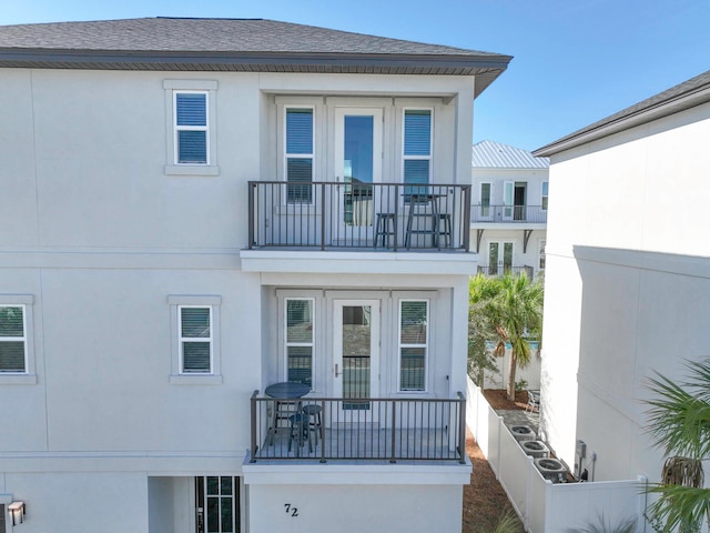 view of front of house featuring a balcony