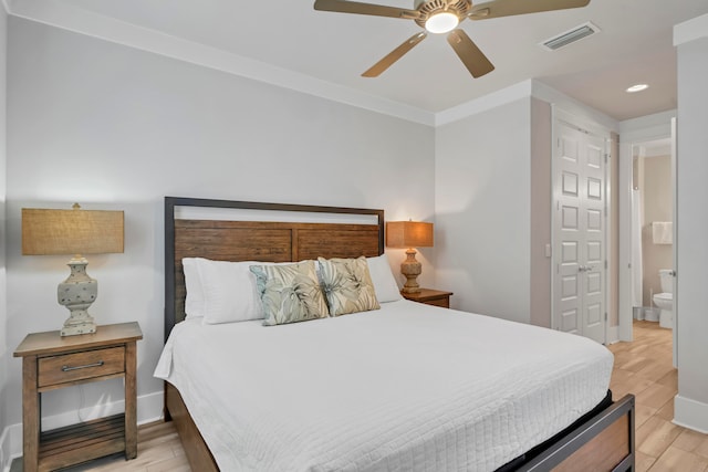 bedroom with ceiling fan, ornamental molding, ensuite bath, and light hardwood / wood-style floors