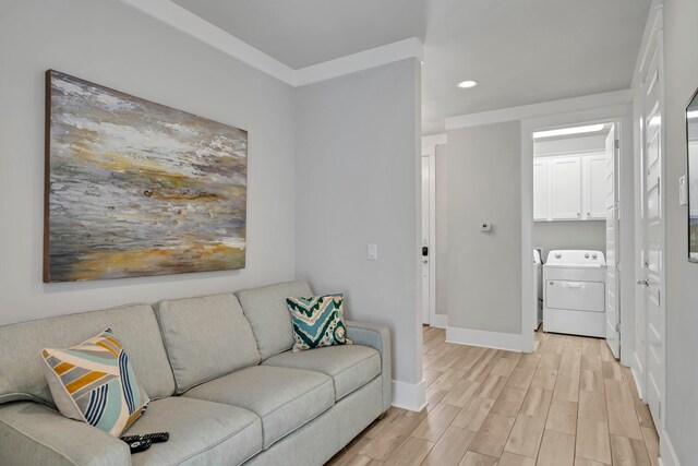 living room featuring light hardwood / wood-style flooring and washer and dryer