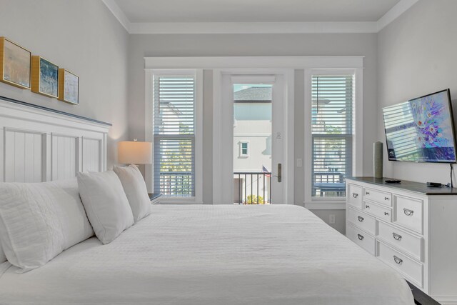 bedroom with access to exterior and ornamental molding