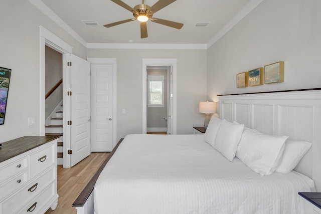 bedroom with light wood-type flooring and ceiling fan