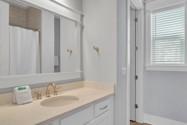 bathroom featuring plenty of natural light and vanity