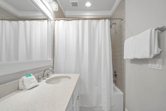 bathroom with shower / bath combo with shower curtain and vanity