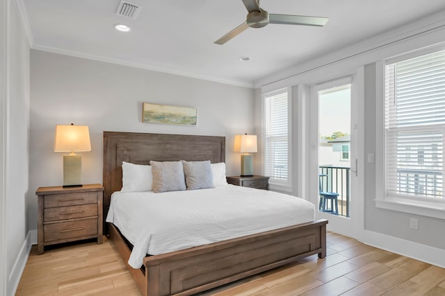 bedroom featuring ceiling fan, light hardwood / wood-style floors, and multiple windows