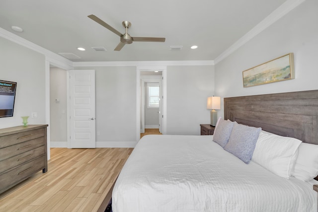 bedroom featuring ceiling fan, light wood-type flooring, and ornamental molding