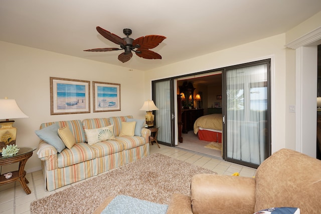 living room featuring ceiling fan and light tile patterned flooring