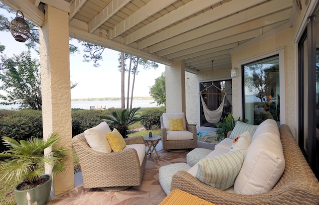 view of patio / terrace featuring an outdoor living space and a water view