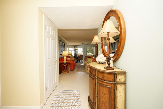 hallway featuring a textured ceiling