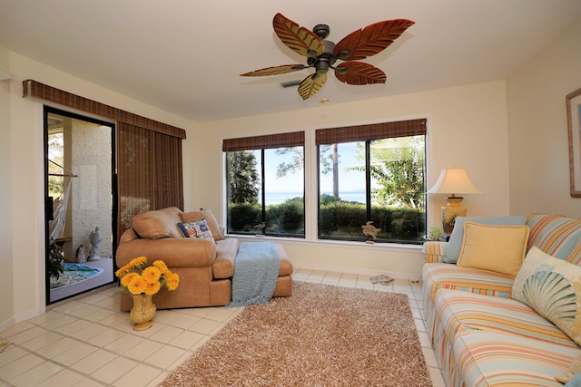 tiled living room with ceiling fan