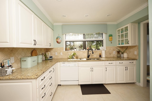 kitchen with ornamental molding, white cabinets, white dishwasher, and sink