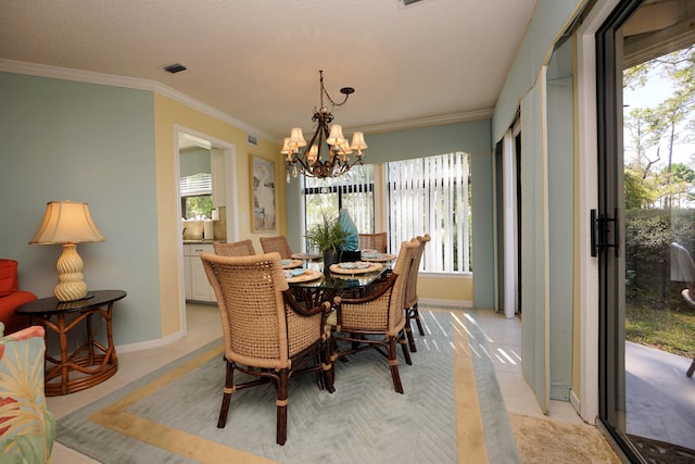 dining space featuring a chandelier, a textured ceiling, and crown molding