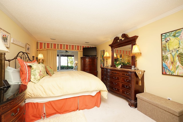 bedroom featuring ornamental molding, carpet, and a textured ceiling