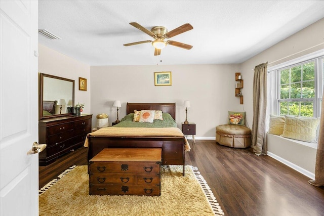 bedroom featuring dark hardwood / wood-style floors and ceiling fan