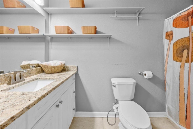 bathroom with toilet, vanity, a shower with shower curtain, and tile patterned flooring