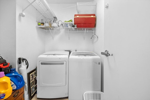 laundry area featuring washing machine and clothes dryer