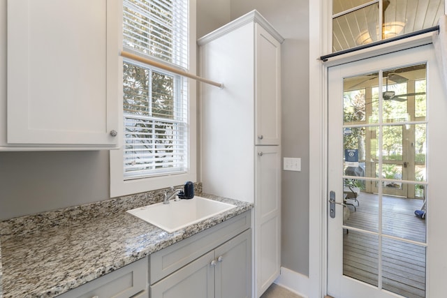 interior space featuring a wealth of natural light and sink