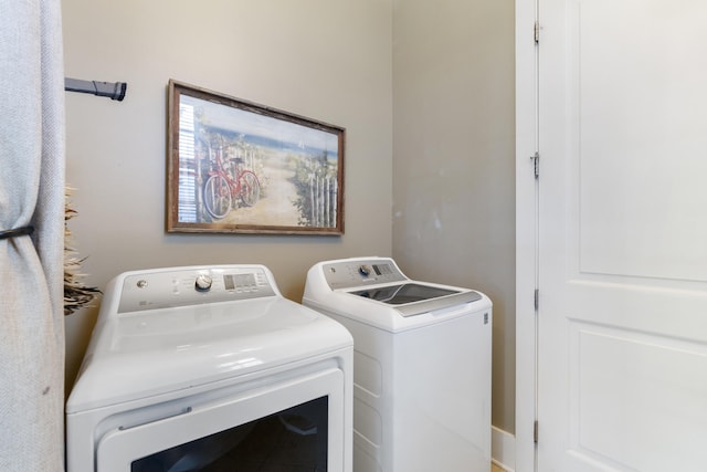 laundry room featuring washing machine and dryer