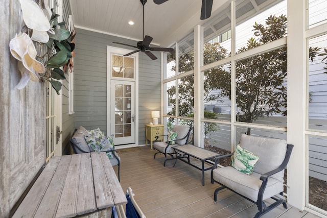 sunroom featuring ceiling fan